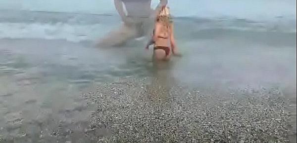  Fucks blonde in the ass on the beach.